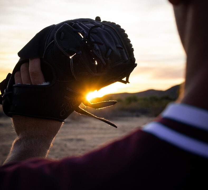 man holding baseball mitt