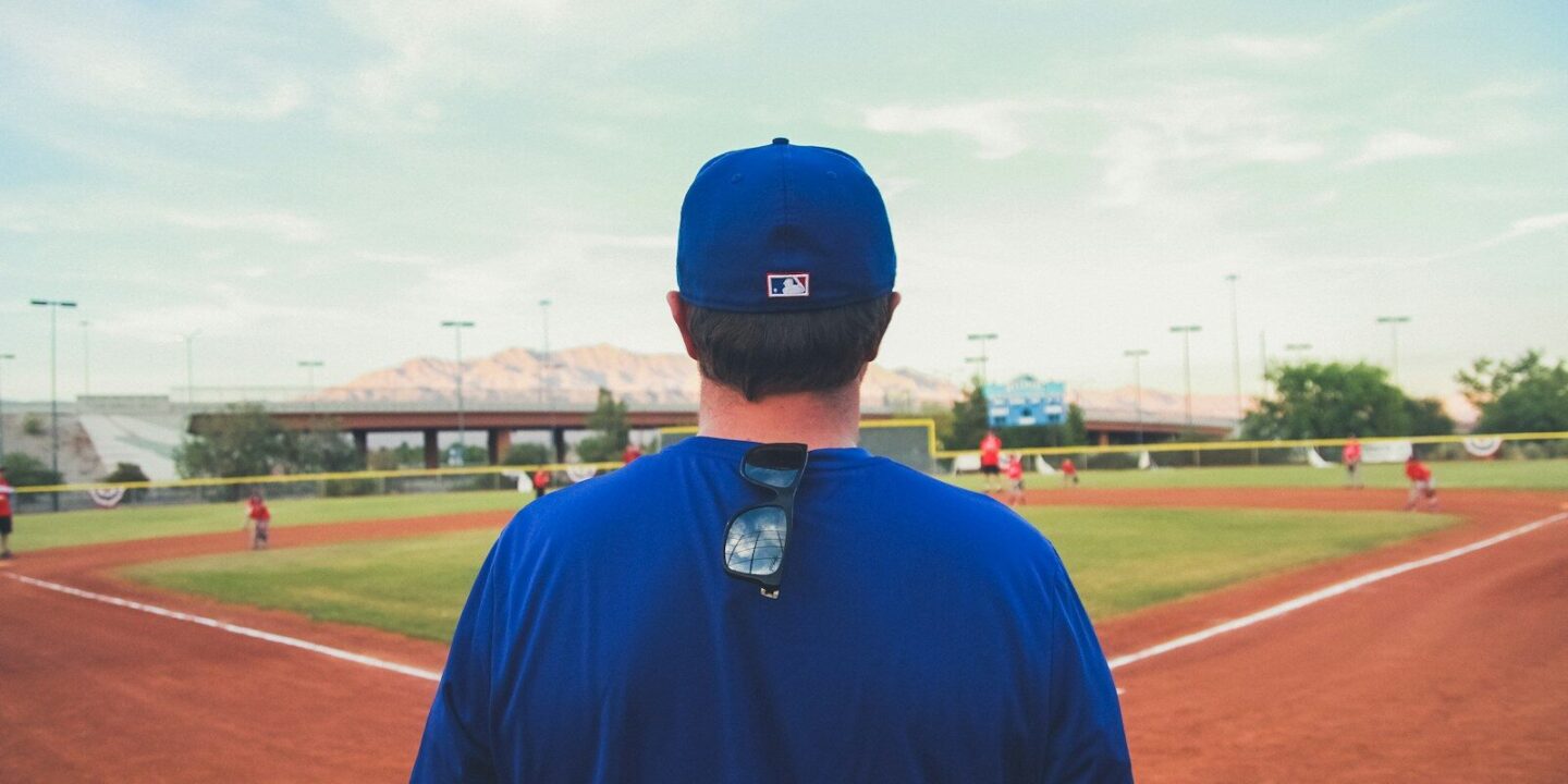 man overlooking baseball field